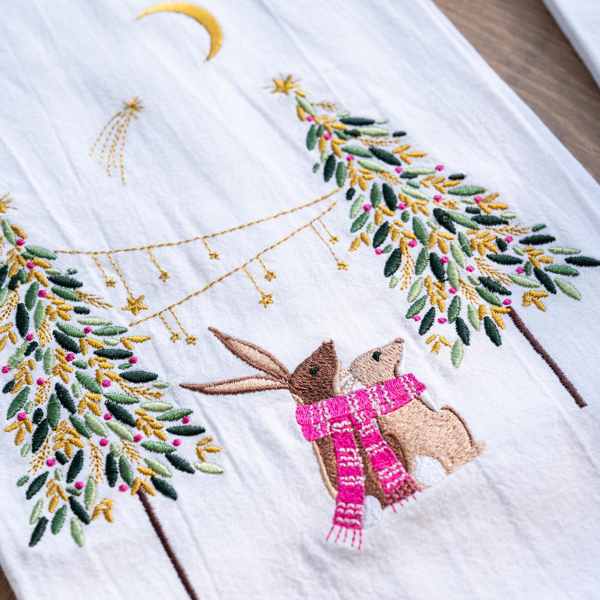 A moonlit rabbits embroidered towel.