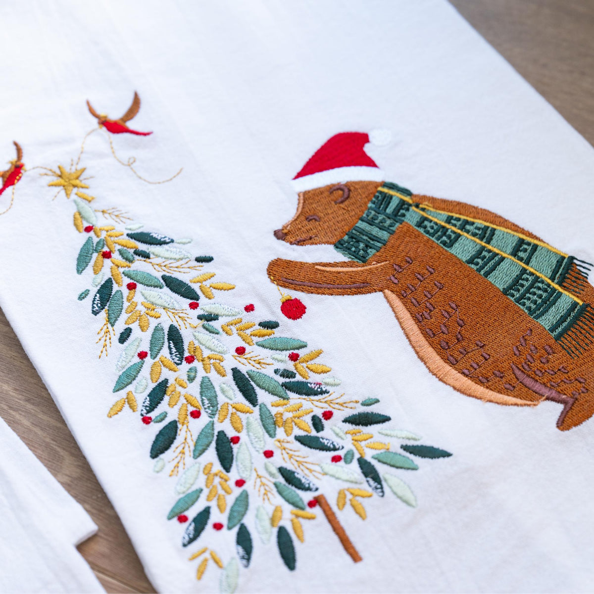 A bear tree decorating embroidered towel.