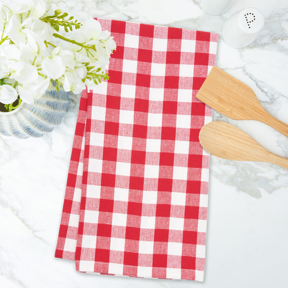 woven red and white checkered gingham kitchen towel on a marble countertop