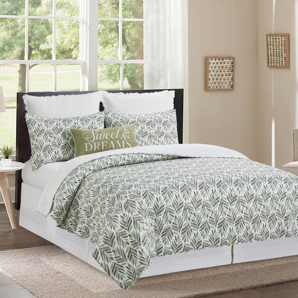 quilt with watercolor inspired foliage pattern that reverses to a coordinating rain drop pattern