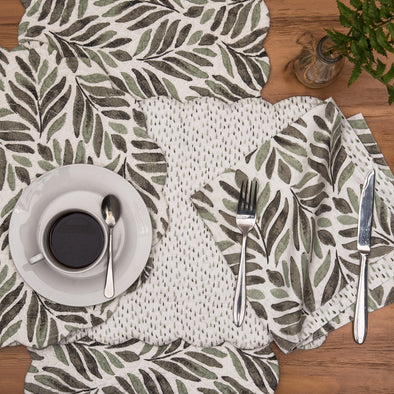 watercolor botanical leaves quilted table linen collection that reverses to a tiny raindrop pattern in coordinating colors