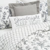 intricate black floral quilt with a crosstitch pattern on the reverse side