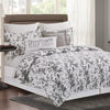 intricate black floral quilt with a crosstitch pattern on the reverse side