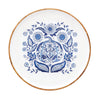 Wood plate with a white bottom featuring a blue pumpkin and sunflower design