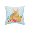 This pillow features a printed design of a brown bunny surrounded by sprigs of flowers & Easter eggs on a blue ground.