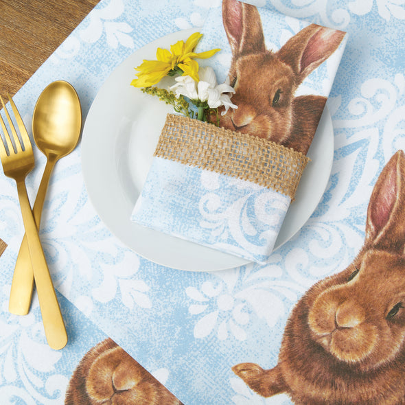 printed table linens with a blue damask background and a realistic brown bunny 