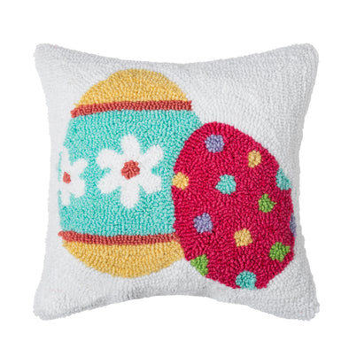 The Easter Eggs hooked pillow features brightly decorated Easter eggs with vibrant colors like yellow, pink, blue and others against a white background providing a beautiful contrast of colors. 