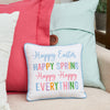 Happy Easter Happy Everything Pillow on a couch with a pink and blue pillow
