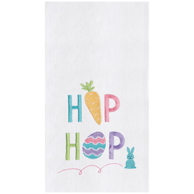 a flour sack towel with the words hip hop in pastel Easter hues. The I in Hip is replaced by a carrot and the O in Hop is replaced by an Easter egg. A bouncing bunny sits next to this phrase