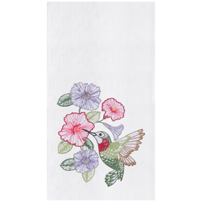 flour sack towel with an array of hibiscus flowers and a graceful hummingbird drinking from the blooms