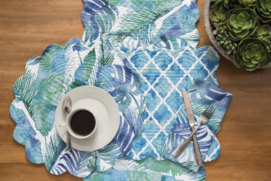 blue and green patterned quilted table linens with reversable to a palm leaf pattern