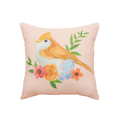 This pillow features a printed design of a gold-brown bird surrounded by sprigs of flowers & Easter eggs on a pink ground.
