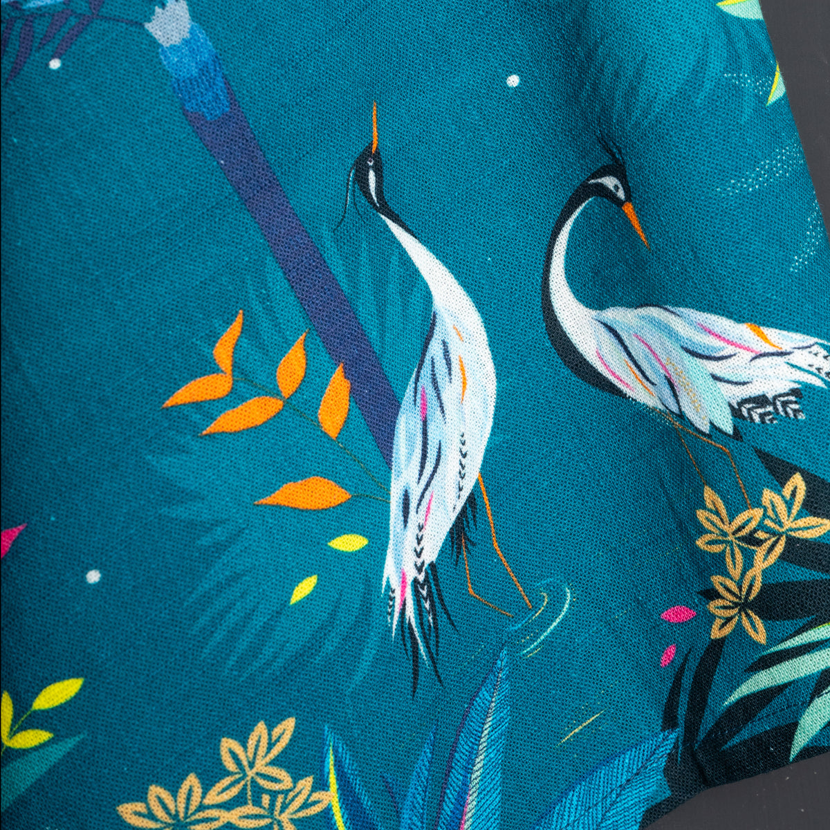 A teal heron screen printed towel.