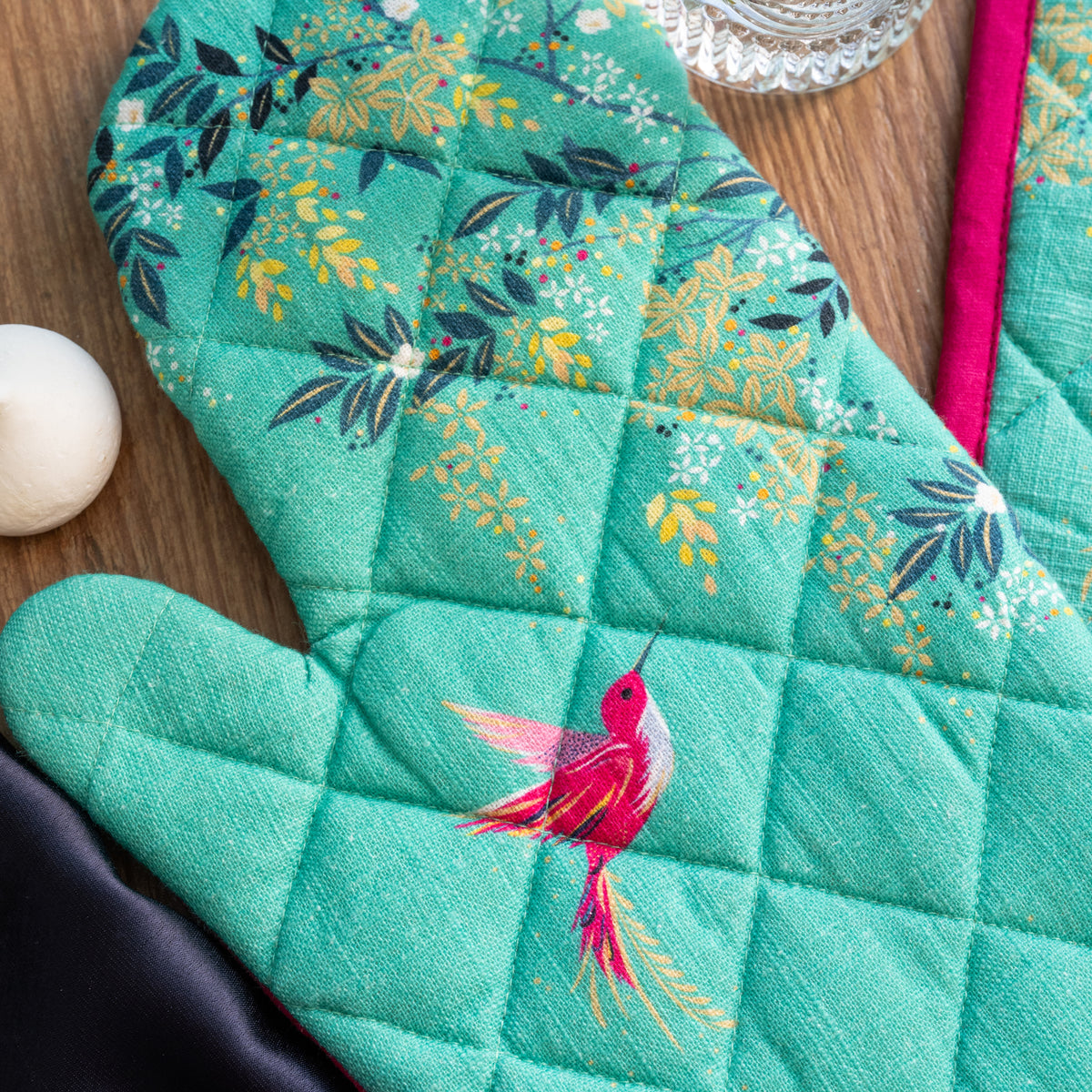 A chelsea teal oven mitt & potholder set.
