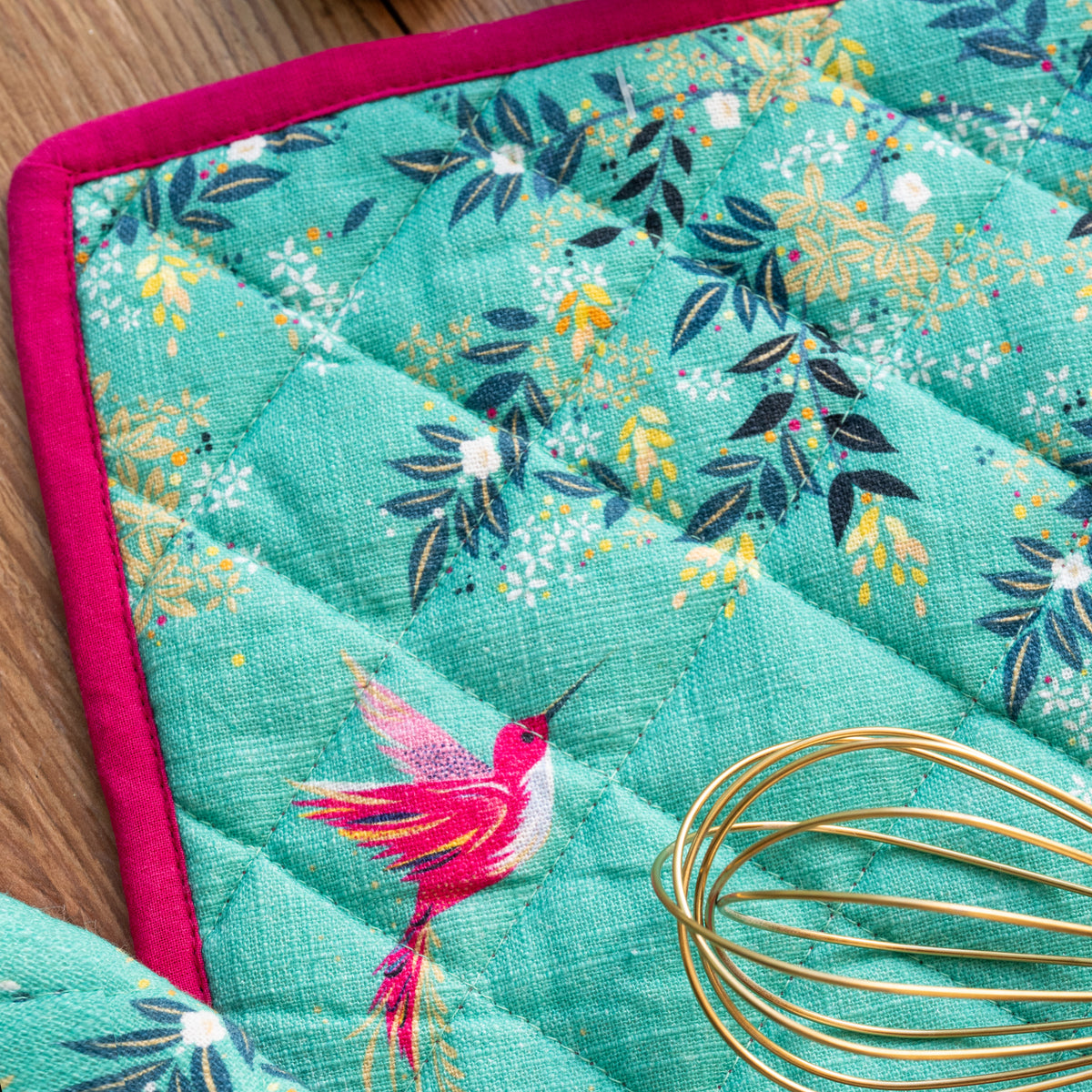 A chelsea teal oven mitt & potholder set.