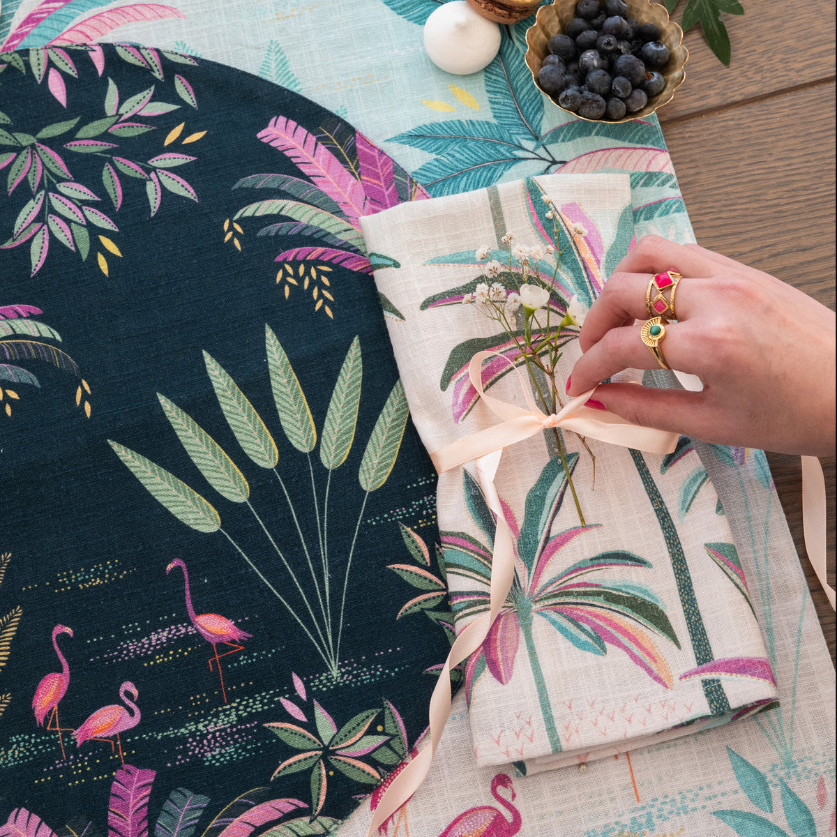 flamingo palms table linens table linens displayed as a coordinated tabletop setting.