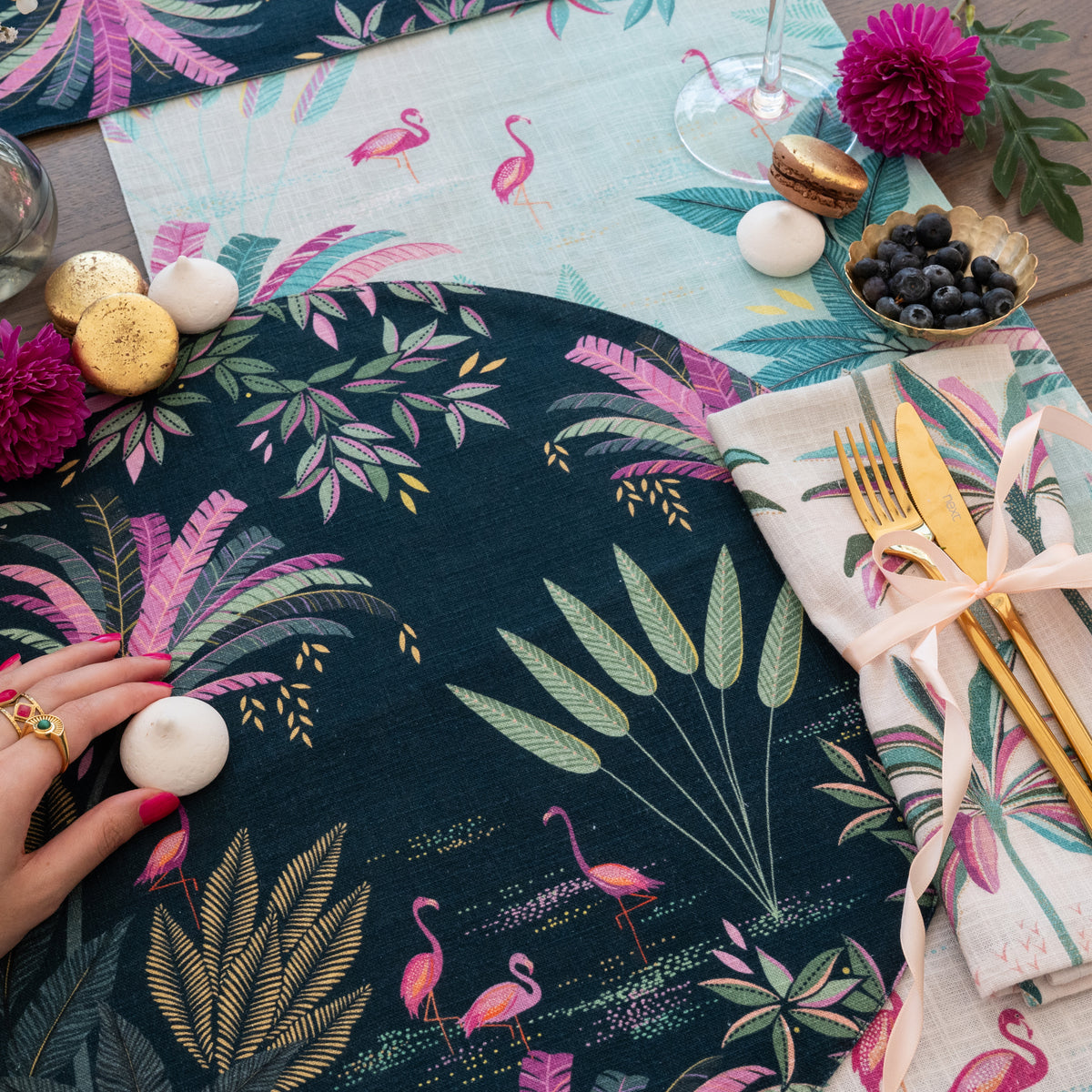 flamingo palms table linens table linens displayed as a coordinated tabletop setting.