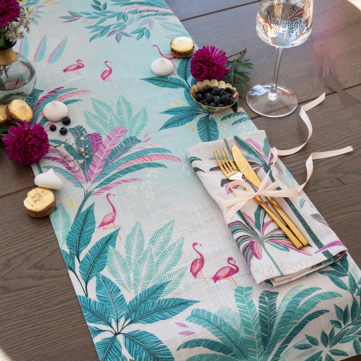 flamingo palms table linens table linens displayed as a coordinated tabletop setting.
