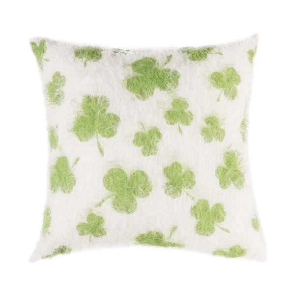 green shamrocks on a white fuzzy textured pillow