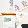 embroidered waffle weave sports themed towels in a kitchen setting