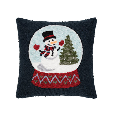 a dark hooked pillow with a snow globe in the center with a cheerful snowman and Christmas tree inside