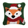 hooked pillow depicting an orange fox wearing a red hat and scarf on a forest green background