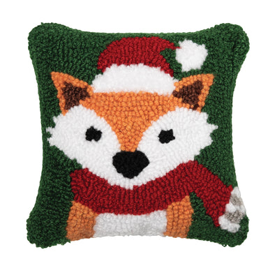 hooked pillow depicting an orange fox wearing a red hat and scarf on a forest green background