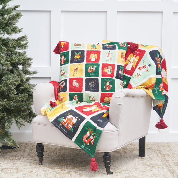 Alphabet Grid Throw and Pillow styled next to a Christmas tree.