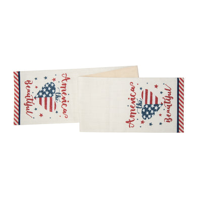 a printed table runner with the phrase America the beautiful in a flourishing script font paired with a heart that resembles the American flag and little red and blue stars. the edge of the runner has red and white stripes