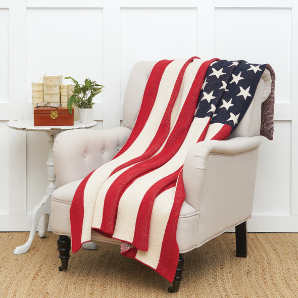 knitted throw that resembles an American flag design on a chair