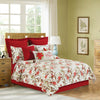 Side view of the Averie Quilted Bedding Set styled with holiday pillow accessories.