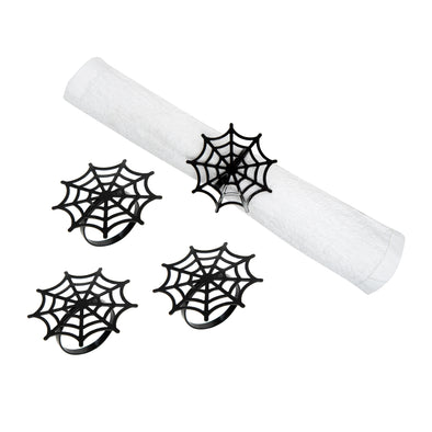 napkin rings that resemble little spider's webs with one shown in use wrapped around a napkin