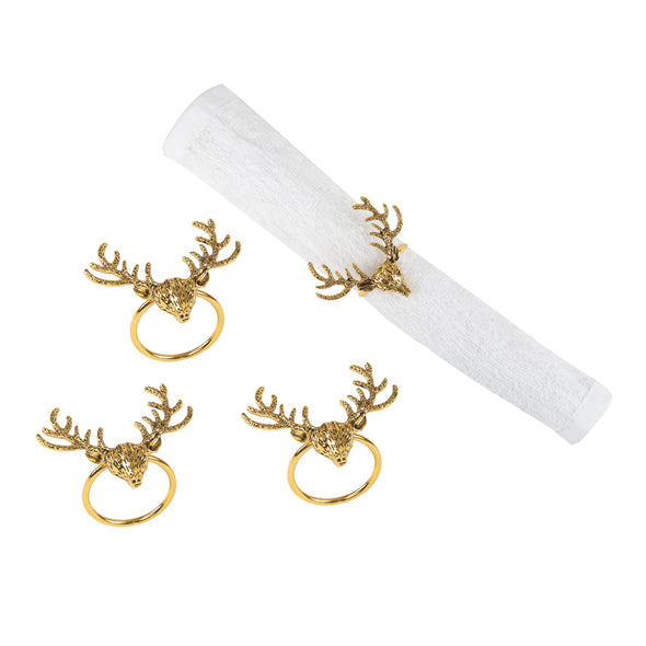 gold napkin rings shaped like deer buck heads with antlers - one wrapped around a white napkin