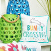 bunny crossing pillow next two a blue and green lantern 