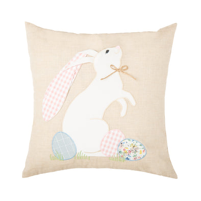 applique white bunny on a tan pillow with patterned easter eggs