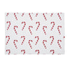 printed placemat with red and white candy canes on a white background