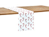 printed runner with red and white candy canes on a white background