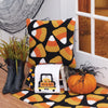 white waffle weave towel with a black truck filled with candy corn and the phrase trick or treat surrounded by Halloween decor