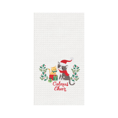 catmas cheer kitchen towel, a cat with a santa hat and scarf on with a kitchen on a present on a white towel