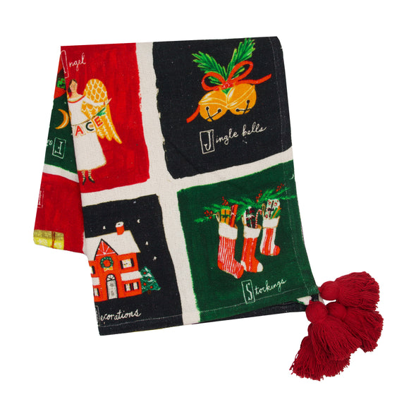 Christmas alphabet grid throw is full of festive images in a grid formation with tasseled corners