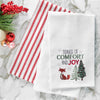 waffle weave towel with the words tidings of comfort and joy above a fox and christmas trees on a marble countertop