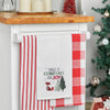 waffle weave towel with the words tidings of comfort and joy above a fox and christmas trees hanging from a kitchen countertop