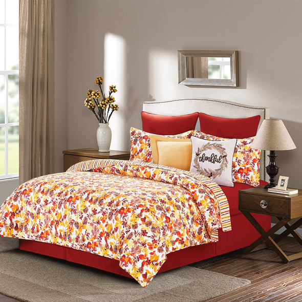 Cordelia quilted bedding styled with decorative throw pillows.