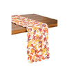 Cordelia quilted table runner draped over a table edge.