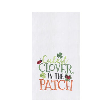 flour sack white towel with lady bugs and clovers on the words "cutest clover in the patch" written in light green, dark green, black and orange 