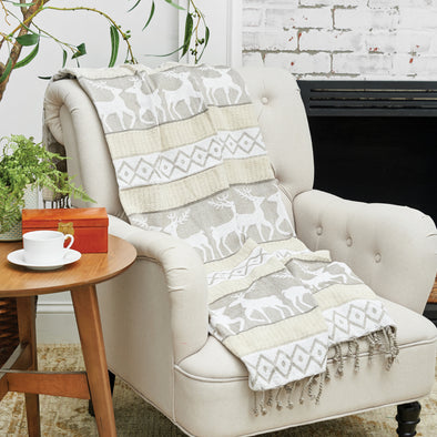 deer christmas throw with stripes of tan, grey and white with deer and tribal prints with twist tassel edges