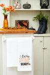 Embroidered Eat, Drink and be Scary kitchen towel styled in a Halloween themed kitchen.