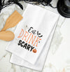 Embroidered Eat, Drink and be Scary kitchen towel styled on a marble countertop.