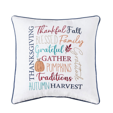 embroidered pillow with various harvest and fall related words in a variety of font styles