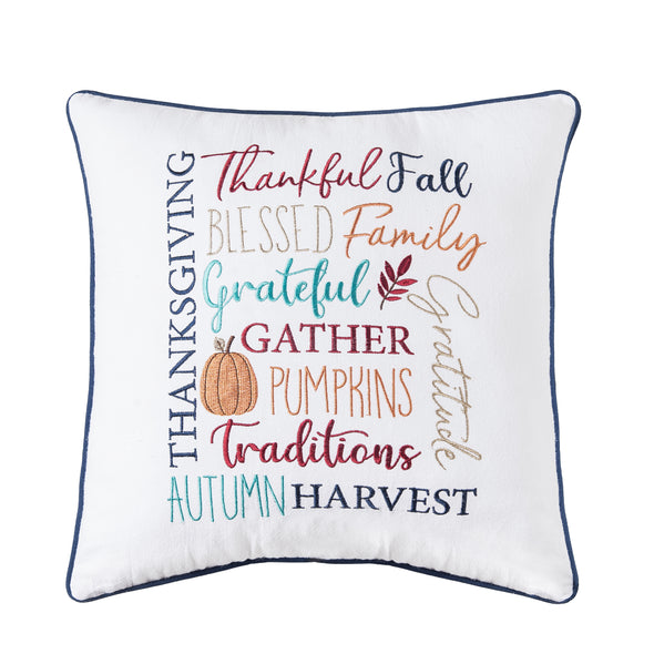 embroidered pillow with various harvest and fall related words in a variety of font styles